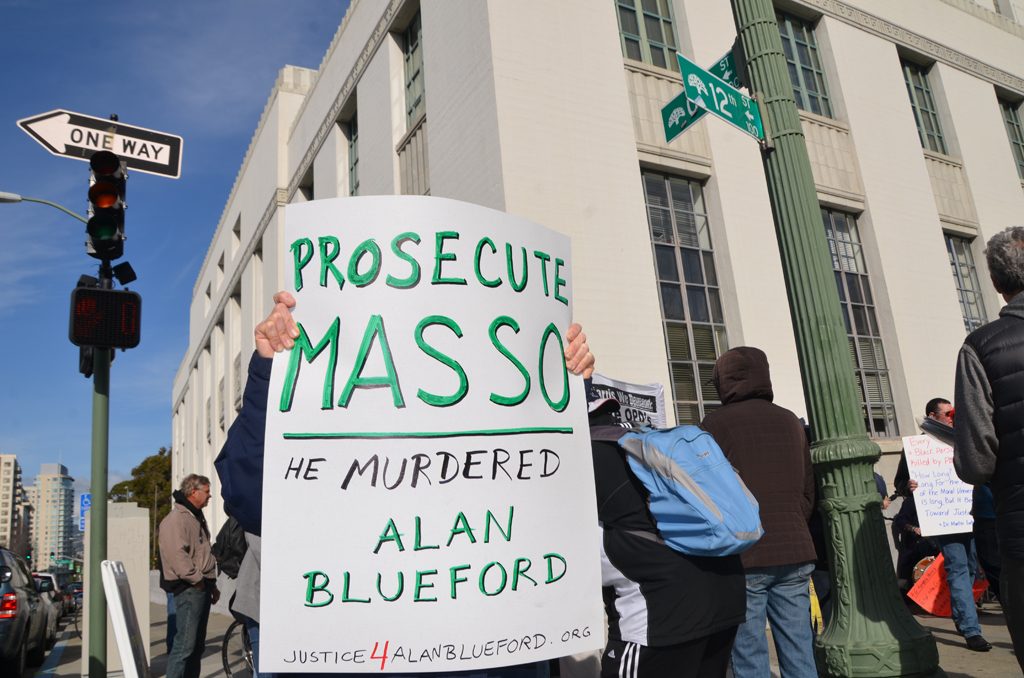 Oakland residents gather to protest the killing of Alan Blueford by an Oakland police officer.