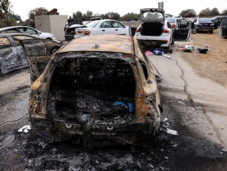 Burnt cars are abandoned in a carpark near where a music festival was held before an attack by Hamas from Gaza
